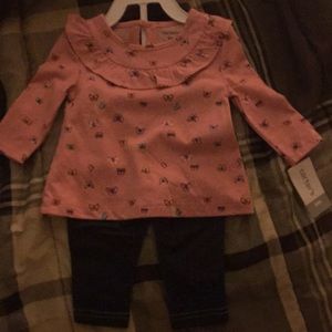 A long sleeved outfit for a baby girl.